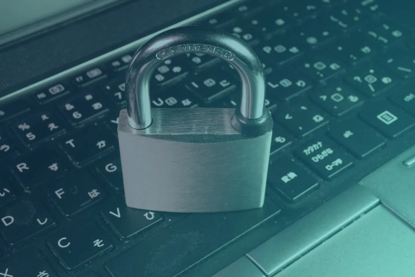 A padlock resting on a computer keyboard