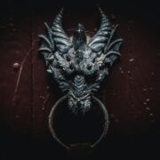Grey dragon head on door