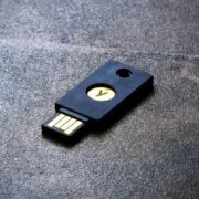 A YubiKey pictured lying on a flat surface