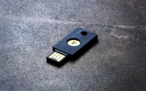 A YubiKey pictured lying on a flat surface